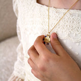 Collar medalla virgen niña bordeada de piedras naturales