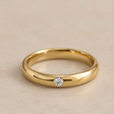 Alianza de boda con 1 diamante en oro 18k